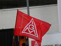 IG Metall is seen during a strike at a BMW factory site in Munich, Germany, 2 February 2017.. A few thousand came to the rally in front of t...