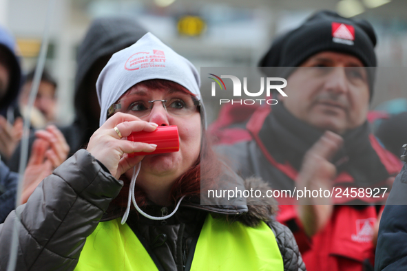 Striking worker blowing the whistle taking part in a strike at a BMW factory site in Munich, Germany, 2 February 2017. A few thousand came t...