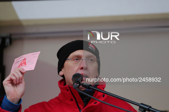 Horst Lischka holding a striking card from 1995 during a strike at a BMW factory site in Munich, Germany, 2 February 2017.. A few thousand c...