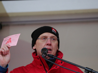 Horst Lischka holding a striking card from 1995 during a strike at a BMW factory site in Munich, Germany, 2 February 2017.. A few thousand c...