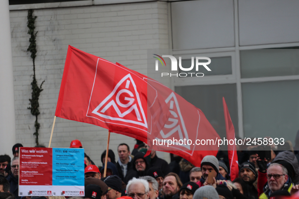 IG Metall flags taking is seen during a strike at a BMW factory site in Munich, Germany, 2 February 2017. A few thousand came to the rally i...