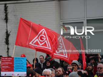 IG Metall flags taking is seen during a strike at a BMW factory site in Munich, Germany, 2 February 2017. A few thousand came to the rally i...