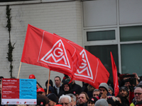 IG Metall flags taking is seen during a strike at a BMW factory site in Munich, Germany, 2 February 2017. A few thousand came to the rally i...