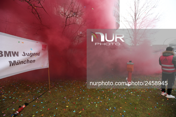 Smoke bombs is seen during a strike at a BMW factory site in Munich, Germany, 2 February 2017.  A few thousand came to the rally in front of...