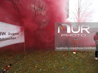 Smoke bombs is seen during a strike at a BMW factory site in Munich, Germany, 2 February 2017.  A few thousand came to the rally in front of...