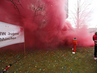 Smoke bombs is seen during a strike at a BMW factory site in Munich, Germany, 2 February 2017.  A few thousand came to the rally in front of...