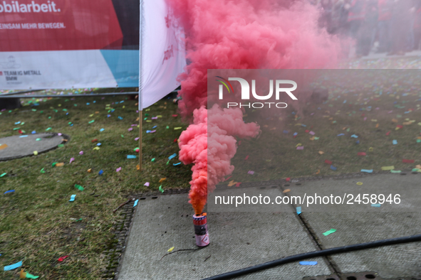 Smoke bombs is seen during a strike at a BMW factory site in Munich, Germany, 2 February 2017. A few thousand came to the rally in front of...