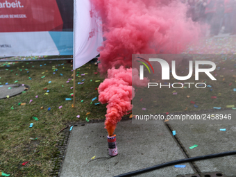 Smoke bombs is seen during a strike at a BMW factory site in Munich, Germany, 2 February 2017. A few thousand came to the rally in front of...