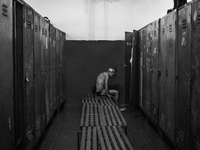  Italy, Sardinia 2013 A old miner sitting in front of his clock room after a long day of work (