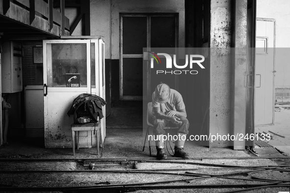 Italy, Sardinia 2014 Giacomo, 26, a young miner waiting the lift to reach the coal mine and start to work. His father is a miner near to the...