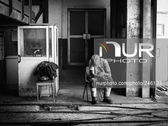 Italy, Sardinia 2014 Giacomo, 26, a young miner waiting the lift to reach the coal mine and start to work. His father is a miner near to the...