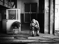 Italy, Sardinia 2014 Giacomo, 26, a young miner waiting the lift to reach the coal mine and start to work. His father is a miner near to the...