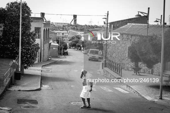 Italy, Sardinia, 2014 A old man is crossing the street in Nuraxi Figus, a little town in Sardegna with less than 600 people, most of them wo...