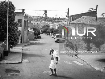 Italy, Sardinia, 2014 A old man is crossing the street in Nuraxi Figus, a little town in Sardegna with less than 600 people, most of them wo...