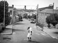 Italy, Sardinia, 2014 A old man is crossing the street in Nuraxi Figus, a little town in Sardegna with less than 600 people, most of them wo...