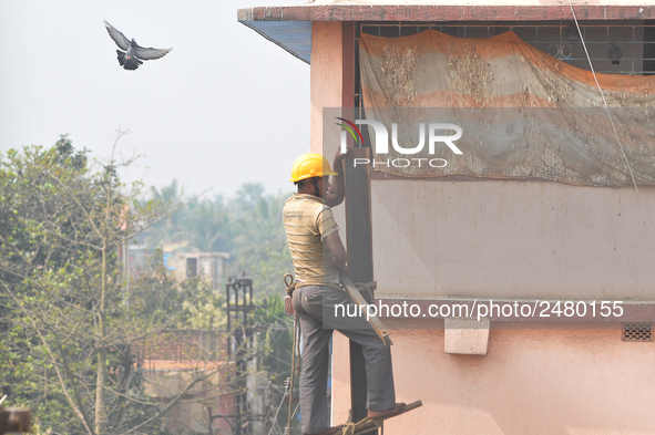 Labour work Road side Electrical post on February  13, 2018 in Kolkata City , India. 