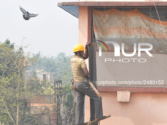 Labour work Road side Electrical post on February  13, 2018 in Kolkata City , India. (