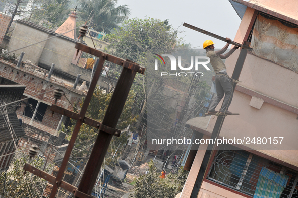 Labour work Road side Electrical post on February  13, 2018 in Kolkata City , India. 