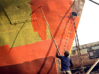 A Painter paint on a long ship at Keraniganj, Dhaka, Bangladesh on 18 February 2018. When it comes to shipping, Bangladesh is known mostly a...