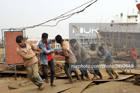 Some of worker pulling the heavy parts of a ship at Keraniganj, Dhaka, Bangladesh on 18 February 2018. When it comes to shipping, Bangladesh...