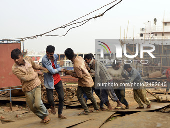 Some of worker pulling the heavy parts of a ship at Keraniganj, Dhaka, Bangladesh on 18 February 2018. When it comes to shipping, Bangladesh...