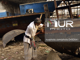 A old worker building a wood ship at Keraniganj, Dhaka, Bangladesh on 18 February 2018. When it comes to shipping, Bangladesh is known mostl...