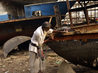 A old worker building a wood ship at Keraniganj, Dhaka, Bangladesh on 18 February 2018. When it comes to shipping, Bangladesh is known mostl...