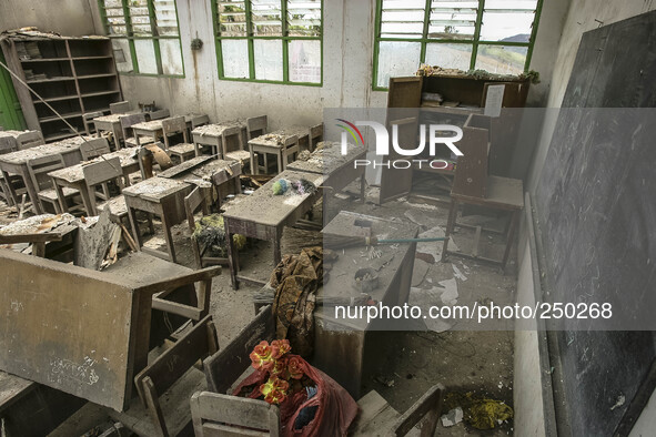 Photo taken on Sept. 12, 2014 shows an abandoned classroom at a damaged school hit by volcanic materials at Sigarang Garang village, Simpang...