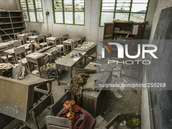 Photo taken on Sept. 12, 2014 shows an abandoned classroom at a damaged school hit by volcanic materials at Sigarang Garang village, Simpang...