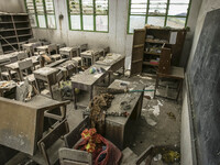 Photo taken on Sept. 12, 2014 shows an abandoned classroom at a damaged school hit by volcanic materials at Sigarang Garang village, Simpang...