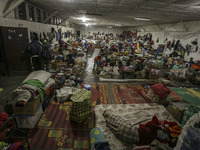 A woman sleep in a refugee camp at Kabanjahe, North Sumatra, Indonesia, on Sept. 11, 2014. The volcano Mount Sinabung has erupted intermitte...