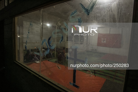 A refugee prayer at refugee camp at Kabanjahe, North Sumatra, Indonesia, on Sept. 11, 2014. The volcano Mount Sinabung has erupted intermitt...