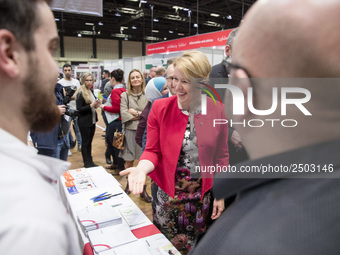 Mayor of Neukoelln Franzisk Giffey (C) visits the stand of Vivantes group during a Job Fair for Refugees and Migrants in Berlin, Germany on...