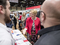 Mayor of Neukoelln Franzisk Giffey (C) visits the stand of Vivantes group during a Job Fair for Refugees and Migrants in Berlin, Germany on...