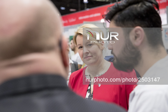 Mayor of Neukoelln Franzisk Giffey (C) visits the stand of Vivantes group during a Job Fair for Refugees and Migrants in Berlin, Germany on...