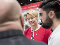 Mayor of Neukoelln Franzisk Giffey (C) visits the stand of Vivantes group during a Job Fair for Refugees and Migrants in Berlin, Germany on...