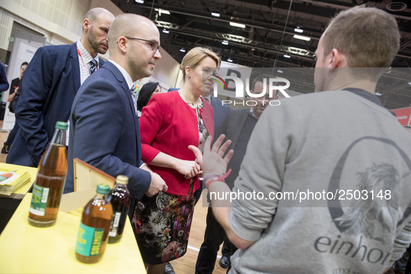 Mayor of Neukoelln Franzisk Giffey (C) visits the stand of Solidrinks during a Job Fair for Refugees and Migrants in Berlin, Germany on Febr...