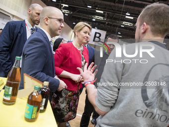 Mayor of Neukoelln Franzisk Giffey (C) visits the stand of Solidrinks during a Job Fair for Refugees and Migrants in Berlin, Germany on Febr...