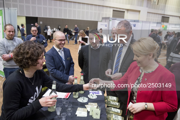 Mayor of Neukoelln Franzisk Giffey (R) visits the stand of Solidrinks during a Job Fair for Refugees and Migrants in Berlin, Germany on Febr...