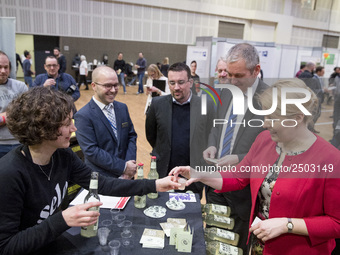 Mayor of Neukoelln Franzisk Giffey (R) visits the stand of Solidrinks during a Job Fair for Refugees and Migrants in Berlin, Germany on Febr...