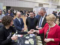 Mayor of Neukoelln Franzisk Giffey (R) visits the stand of Solidrinks during a Job Fair for Refugees and Migrants in Berlin, Germany on Febr...