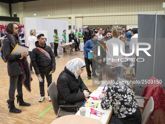 People attend a Job Fair for Refugees and Migrants in Berlin, Germany on February 20, 2018. With over 200 exhibitors and around 3000 job off...