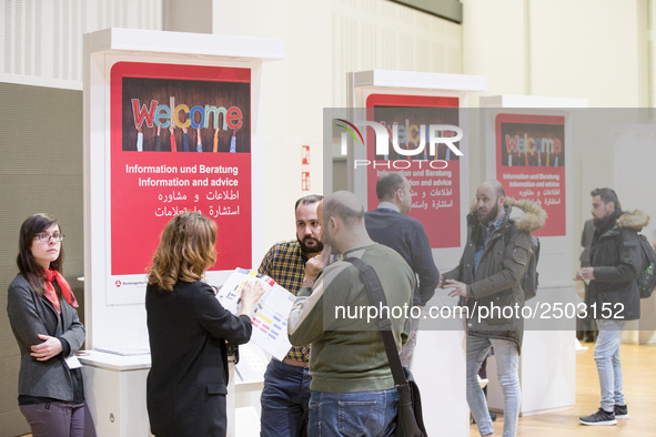 People attend a Job Fair for Refugees and Migrants in Berlin, Germany on February 20, 2018. With over 200 exhibitors and around 3000 job off...