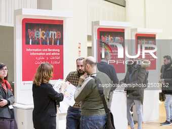 People attend a Job Fair for Refugees and Migrants in Berlin, Germany on February 20, 2018. With over 200 exhibitors and around 3000 job off...