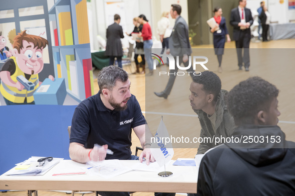 People attend a Job Fair for Refugees and Migrants in Berlin, Germany on February 20, 2018. With over 200 exhibitors and around 3000 job off...