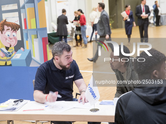 People attend a Job Fair for Refugees and Migrants in Berlin, Germany on February 20, 2018. With over 200 exhibitors and around 3000 job off...