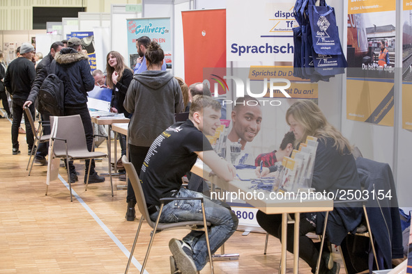 People attend a Job Fair for Refugees and Migrants in Berlin, Germany on February 20, 2018. With over 200 exhibitors and around 3000 job off...