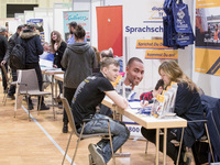 People attend a Job Fair for Refugees and Migrants in Berlin, Germany on February 20, 2018. With over 200 exhibitors and around 3000 job off...