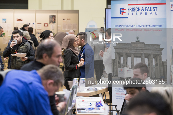 People attend a Job Fair for Refugees and Migrants in Berlin, Germany on February 20, 2018. With over 200 exhibitors and around 3000 job off...