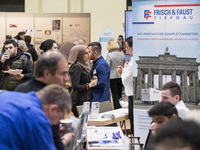 People attend a Job Fair for Refugees and Migrants in Berlin, Germany on February 20, 2018. With over 200 exhibitors and around 3000 job off...